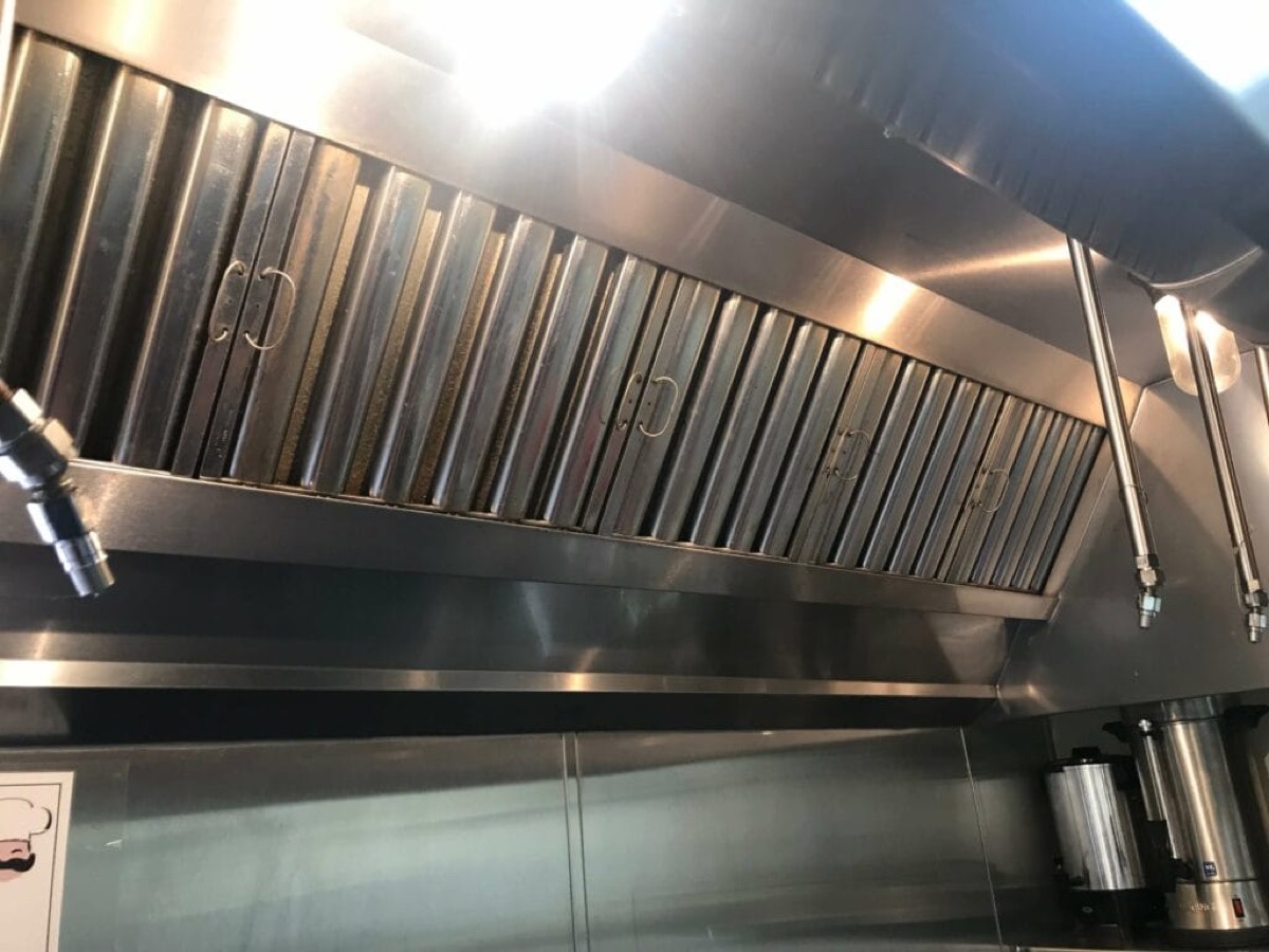 Clean stainless commercial kitchen hood and filters
